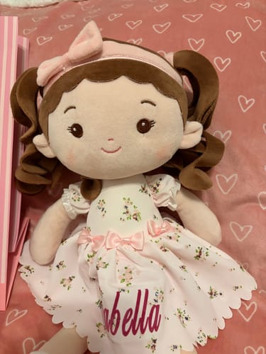 Customer's close-up of the soft Personalized Princess Breeze doll with 'Isabella' embroidered on its pretty dress.