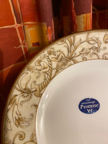 Customer's close-up of the Wedgwood Cornucopia plate, showing the decorative rim and blue Wedgwood Promise sticker.