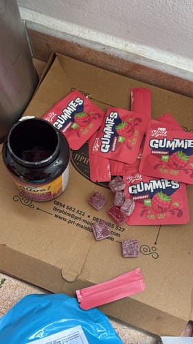 Customer's ROLLZ THC gummies shown out of the package, with red packets and square edibles.