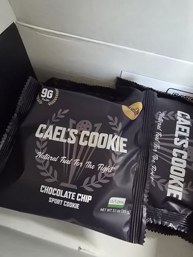 Customer's view of several individually wrapped Cael's Chocolate Chip cookies in a box.