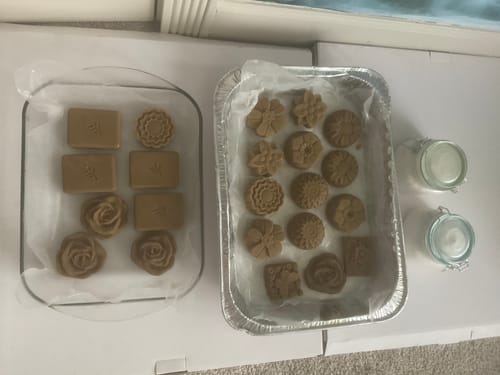 Customer showing various homemade soaps in decorative shapes, created using the Goat Fat - Tallow.