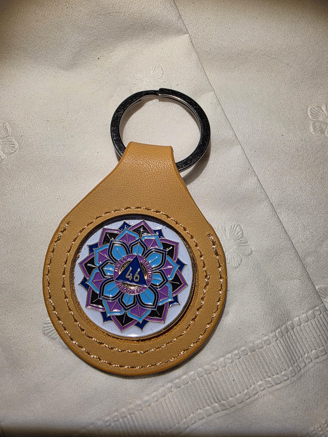 Customer photo review of Sobriety Mint Genuine Leather 34mm AA Medallion Keychain Holder - Recovery Chip/Coin/Token Holder - Tan