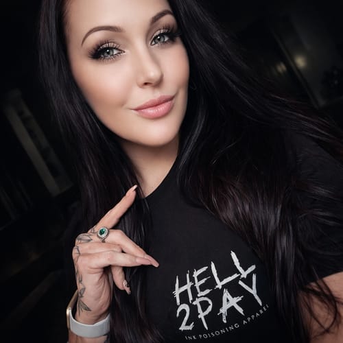 Reviewer wearing the black 'Hell 2 Pay' t-shirt, showing its front text graphic and fit.