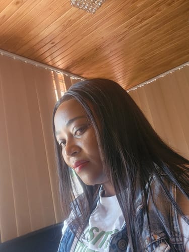 Reviewer selfie showing the long, straight Peruvian LUX 13x4 Lace Frontal Wig.