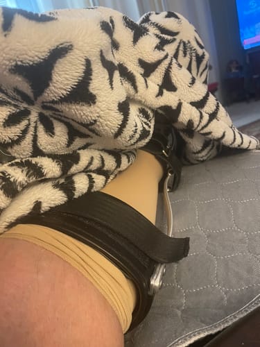 Customer wearing the tan Performance Eucalyptus Compression Socks inside a supportive AFO leg brace.