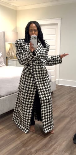 Reviewer in a bedroom taking a mirror selfie wearing the open Jacquard Houndstooth Long Coat, showing its length and padded shoulders.