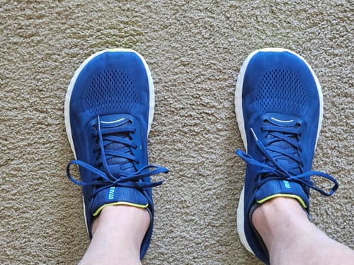 Reviewer's top-down view of their blue MUUV Flow shoes, highlighting the wide toe box design.