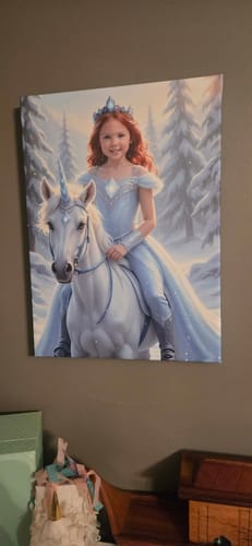Customer's 'The Ice Unicorn Princess' canvas print showing a red-haired girl riding a unicorn in a snowy forest.