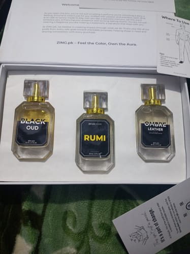 Customer's OUD Supreme BUNDLE showing three glass perfume bottles displayed in a white presentation box.