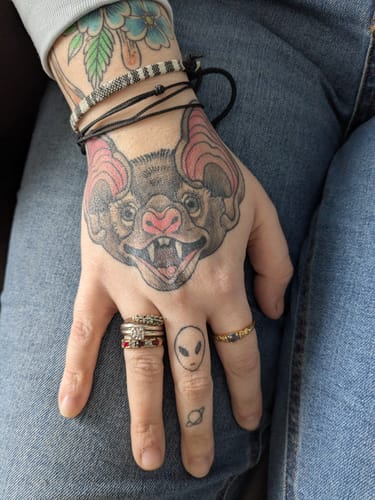 Reviewer shows their healed hand tattoo done using Painless Tattoo Numbing Cream.