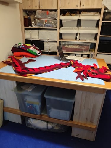 Reviewer's homemade red dragon with a cross-striped belly made from the Cosy Stripe fleece fabric.