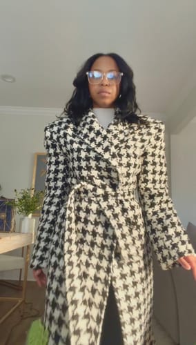 Customer showing a front view of the Jacquard Houndstooth Long Coat tied at the waist, highlighting the bold shoulders.