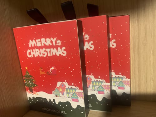 Customer's three festive red packages for the SPOTMINDERS. Tracking Card PRO.