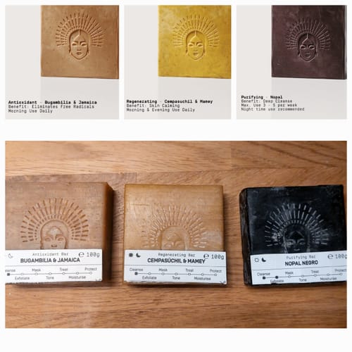 Reviewer's photo of three different Harmony Routine soap bars on a wooden surface, shown below product shots.