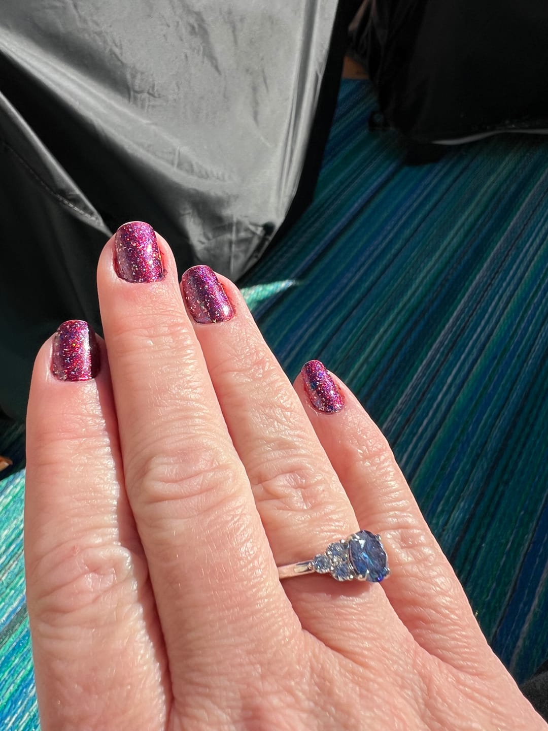 Customer photo review of Colored Round Moissanite Side Stone Engagement Ring