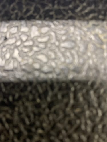 Close-up: A very blurry image from a customer's review of the SPOTMINDERS. Tracking Card.