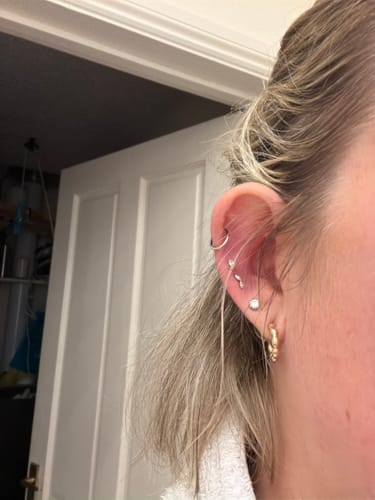 Customer's ear showing the Gilded leaf flatback Gold earring in an upper cartilage piercing.