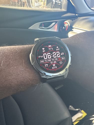 A reviewer's Gard Pro Ultra Series watch on their wrist, showing the digital watch face with its stats.
