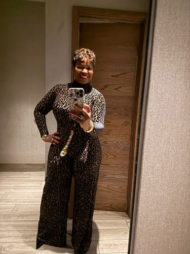 Customer's mirror selfie showing the full silhouette of the leopard print Burnout Wide-Leg Jumpsuit.