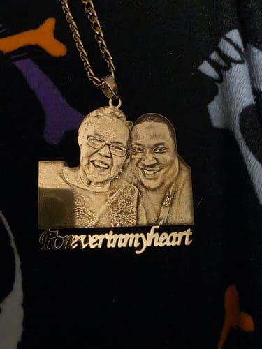 Customer's photo engraved pendant necklace with a detailed image of two people. It has 'Forever in my heart' inscribed below.