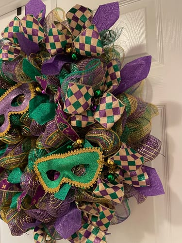 Customer's elaborate Mardi Gras wreath decorated with the purple glittered flower embossed ribbon.