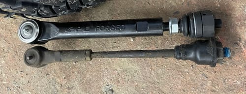 Customer's comparison of the large Stage3 Tie Rod next to the much smaller, original factory part.