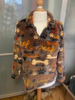 Reviewer's cozy quarter-zip pullover made from the Playful Paws Cuddle Fleece Fabric on a mannequin.