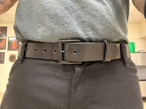 Reviewer wearing the thick, black Everyday work belt with black pants.