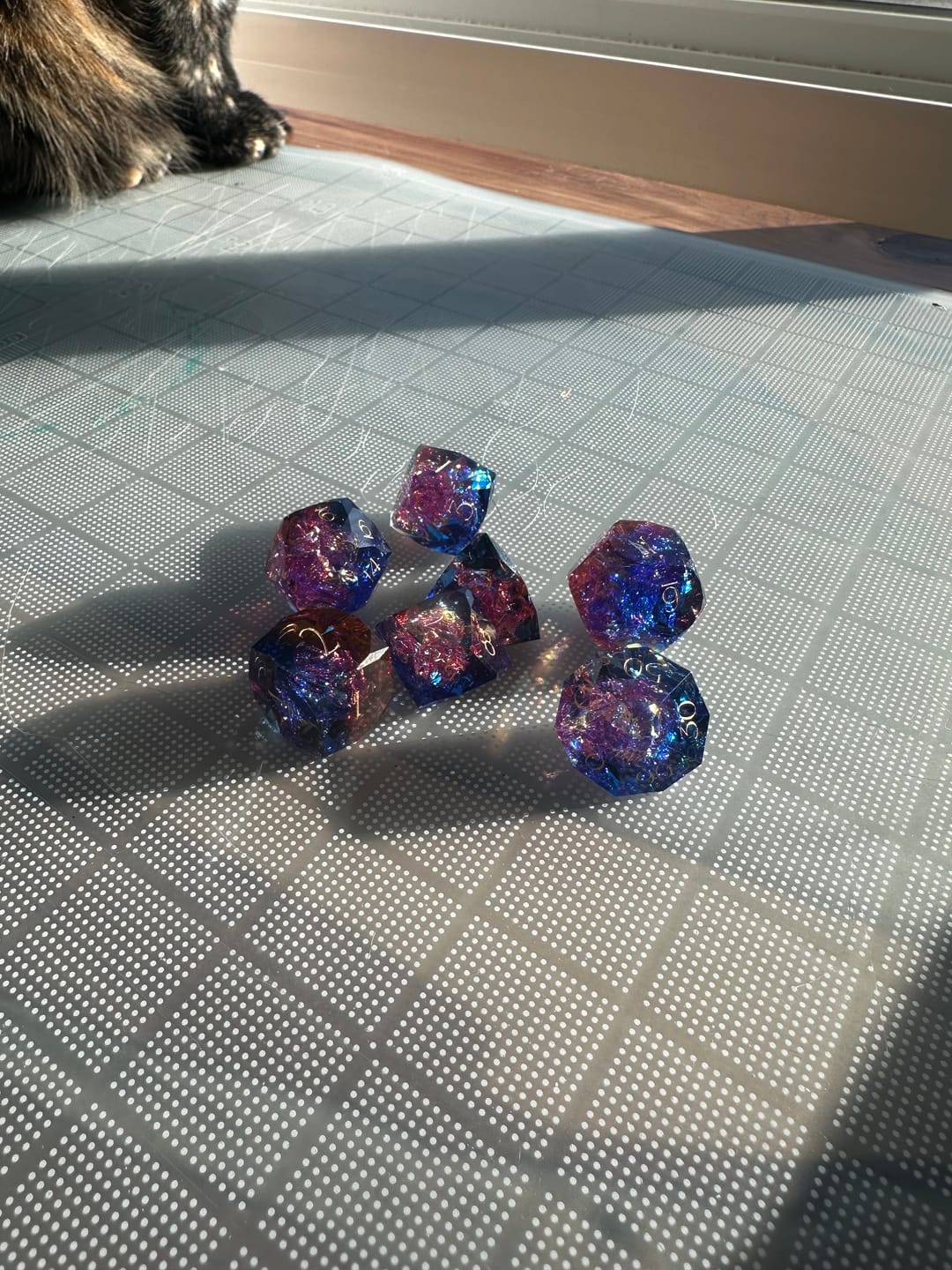 Customer photo review of URWizards D&D Resin Cosmic Burn Engraved Dice Set Multi-faceted Style