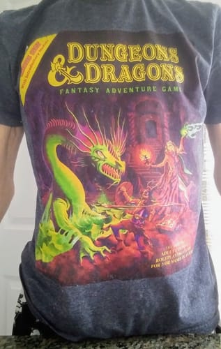 Reviewer wearing the dark gray Dungeons & Dragons t-shirt featuring the classic Basic Set box art.