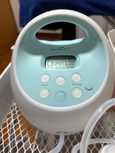 Close-up of the Spectra breast pump a customer uses with their Lovemère Seamless Nursing Bra.