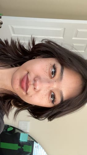 Reviewer's selfie showing the long, expressive style of her Manga lashes.