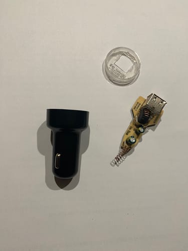 Customer's photo of a disassembled cigarette adapter for the Airmoto inflator.