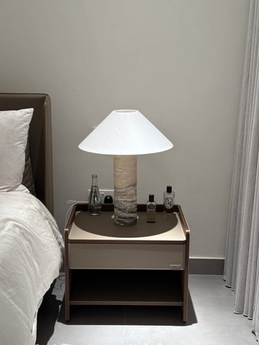 Reviewer's high-end Mycroft Saddle Leather Bedside Table styled in a modern bedroom.
