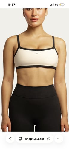 Reviewer wearing the cream and black Micro Bra with black leggings.