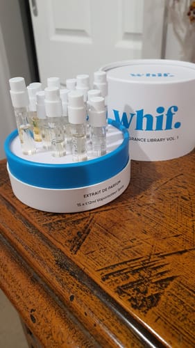 Customer's open Whif Fragrance Library Vol. 1 set, showing the perfume vials on a wooden table.