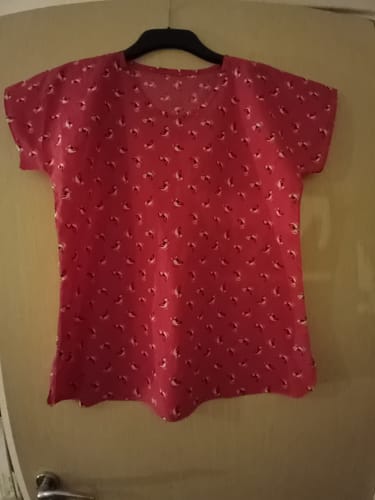 Customer's finished short-sleeve top made from the red Cute Puffins Polycotton Fabric.
