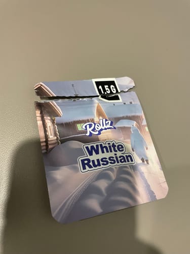 Customer's torn 1.5G package for 'Rollz White Russian' on a flat surface.