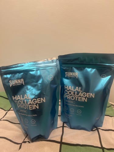 Customer's two shiny, teal pouches of Halal Collagen Protein sitting side-by-side.