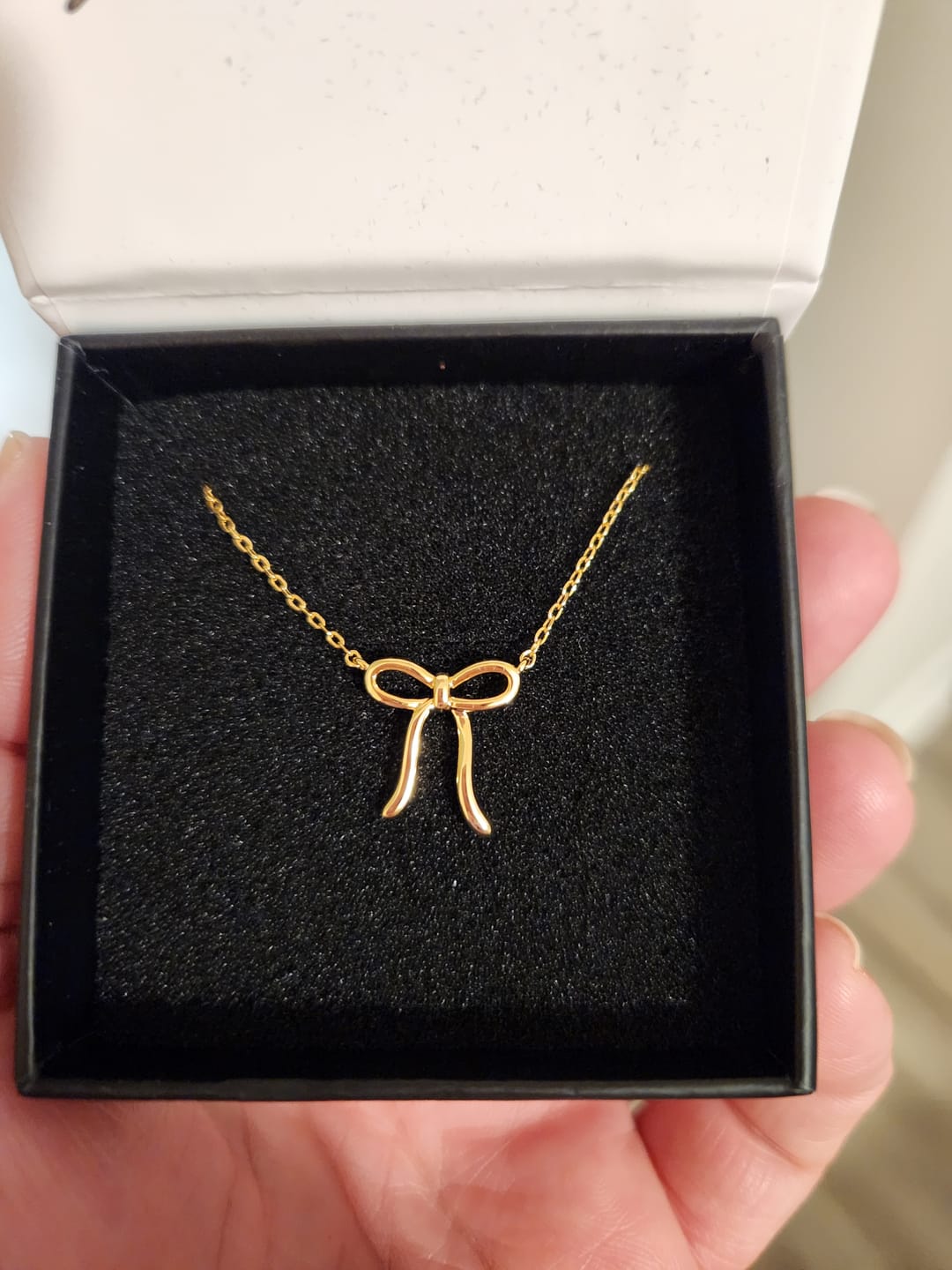 Customer photo review of Lola 18k White Gold Plated Ribbon/Bow Pendant Necklace