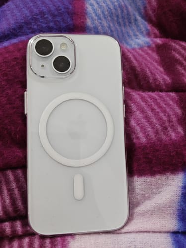 Customer's transparent Anti Yellow Magsafe case on a white iPhone, showing the white magnetic ring on the back.