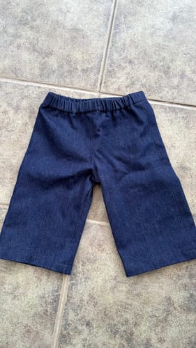 Reviewer's handmade toddler trousers sewn from the washed navy cotton denim fabric.