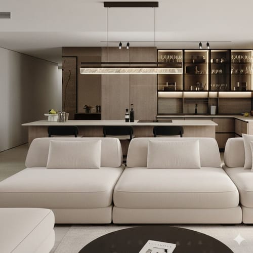 Reviewer's long Pure Gleam Pendant Lamp installed over a modern kitchen island in an open-plan living space.