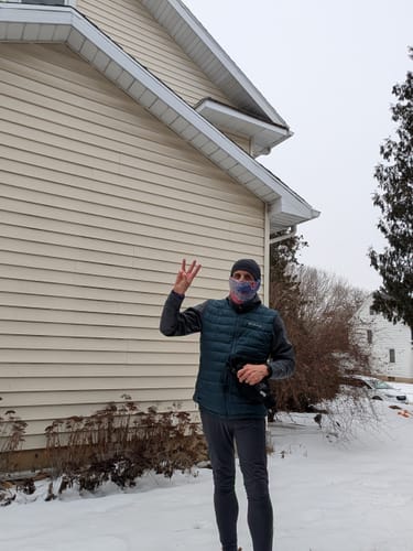 Customer dressed for a winter run, the activity described in their review of the Men's Alpaca Socks.