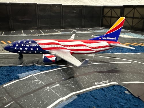 Reviewer's Southwest Freedom One plane toy with its colorful American flag design on a play runway.
