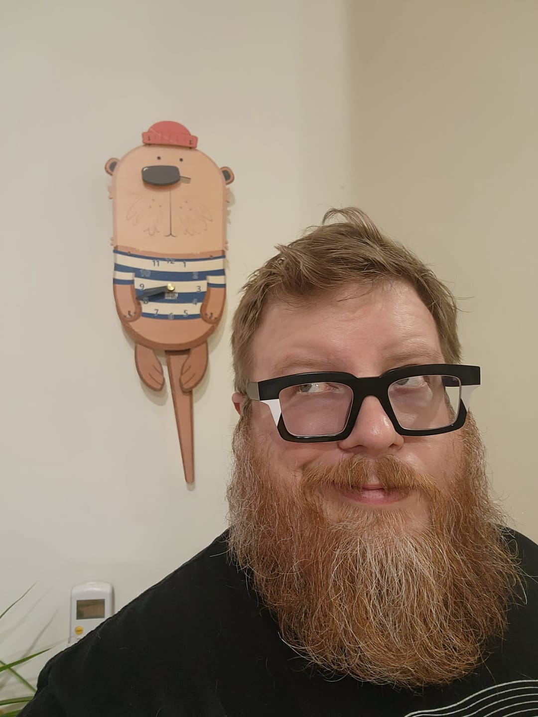 Customer photo review of Waffles the Otter Pendulum Clock