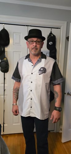Reviewer wearing the color-blocked Miquiztli Button Up Guayabera Shirt with a skull graphic on the chest.