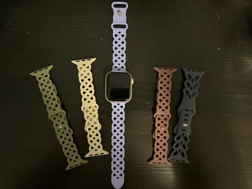 Reviewer's collection of Calla Silicone Straps in five earthy tones, with one lavender strap on an Apple Watch.