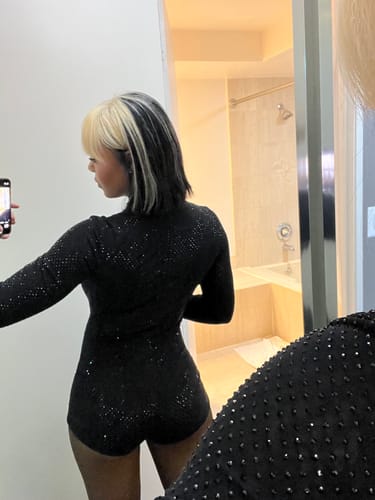 Close-up of the back of the Crystal Turtleneck Romper showing the dense crystal pattern.