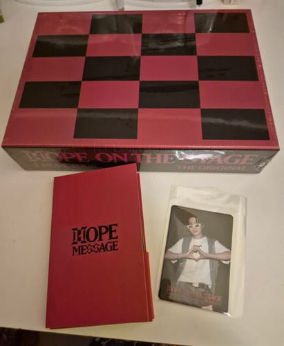 Customer's HOPE ON THE STAGE THE ORIGINAL SET with the checkerboard box, a red booklet, and a photocard of J-Hope.